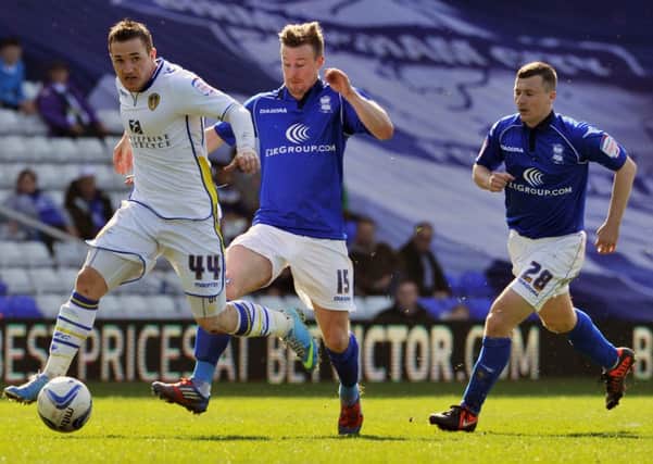 Leeds United's Ross McCormack is chased by Birmingham's Wade Elliott and Paul Caddis. Picture: Bruce Rollinson