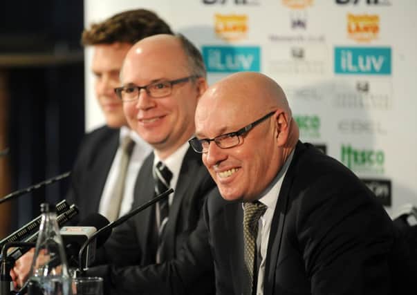Outgoing chief executive Shaun Harvey (centre) is pictired with new Leeds United managing director David Haigh (left) and manager Brian McDermott.