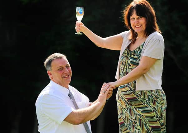 Graham Nield pops the question to Amanda Vickers after winning more than £6m.