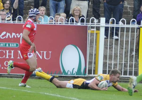 Michael Shenton dives over for a try for Castleford Tigers against Salford before picking up a knee injury that has left him needing an operation. Picture: IAN HARBER