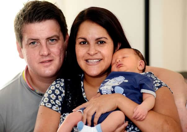 Steve and Maya McCormack with thier new baby boy, Reuben.
p318a337