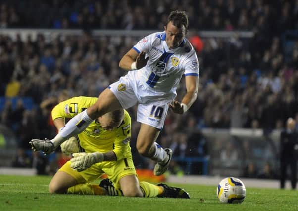 Leeds United's Noel Hunt goes down under a challenge from Bournemouth goalkeeper Ryan Allsop, who was sent-off as a result.