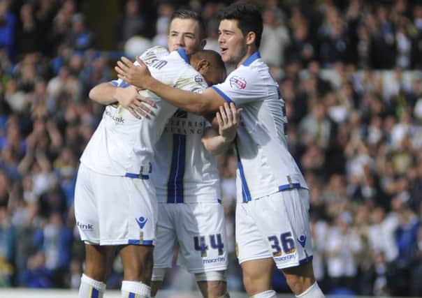 Ross McCormack and Alex Mowatt celebrate with Rudy Austin after he scored a goal against Birmingham.
