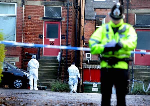 Police forensic officers search a property on the Cardigan Road, Headingley, Leeds, following a shooting last night where a police officer was shot. Picture James Hardisty. Date:4th December 2013.