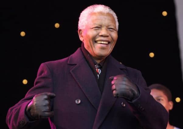 Nelson Mandela  visit to Leeds.30 April 2001.Pictured on the stage Nelson Mandela dances to the crowd during one of the performances from Ladysmith Black Mambazo.