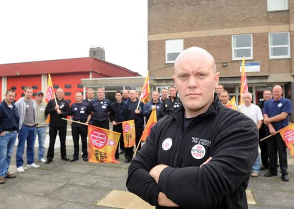 Firefighters at Wakefield Fire Station take part in an earlier round of  strike action in September