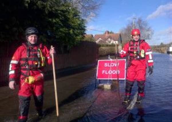 Firefighters from the training centre at Birkenshaw help with the flood relief effort in southern England.