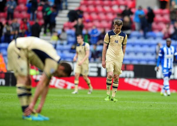 Leeds United players look disappointed after their latest defeat at Wigan.