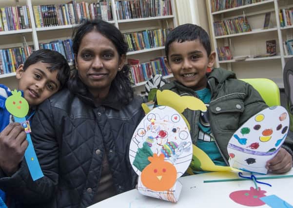 Picture by Allan McKenzie/AMGP.co.uk - South Elmsall Library Easter Day, South Elmsall, England - 050414 - Sharusan Arjil with mum Swarla & brother Pramoth.