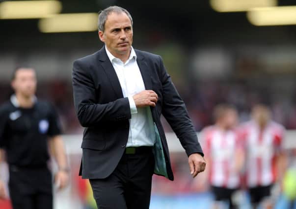 Leeds United's head coach Darko Milanic leaves the pitch at the end of his first game in charge.