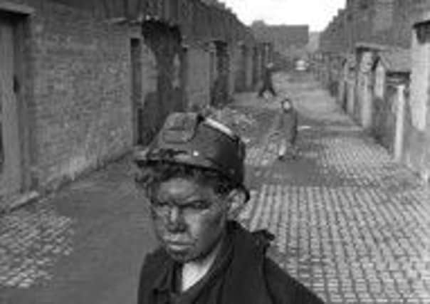 Teenage miner ends his shift at a coal mine in Harden, Yorkshire