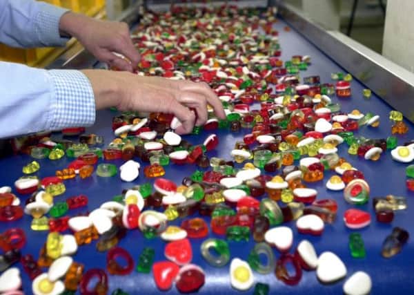 6th April 2004.  Sweets roll off the production lineat the Haribo sweet factory in Pontefract.
