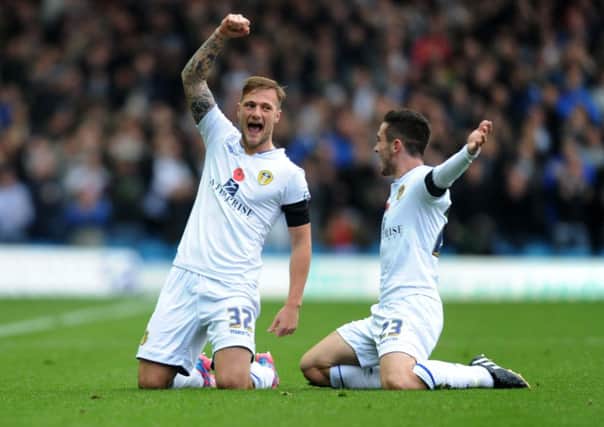 Liam Cooper celebrates his first goal for Leeds United with Lewis Cook during last Saturday's game against Blackpool. Picture Jonathan Gawthorpe.