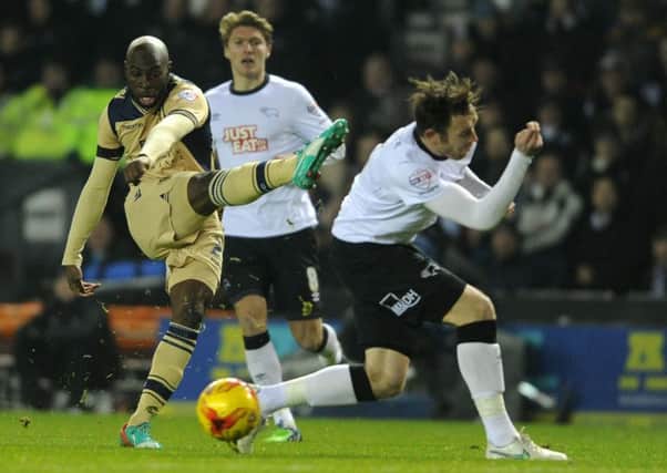 Soulemayne Doukara gets a shot in past Richard Keogh during Leeds United's defeat at Derby County. Picture: Bruce Rollinson