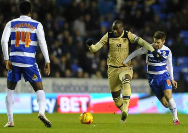Leeds United defender Sol Bamba takes on Reading's Oliver Norwood during Tuesday night's game at the Madejski Stadium. Bamba has helped United tighten up at the back in recent games.
