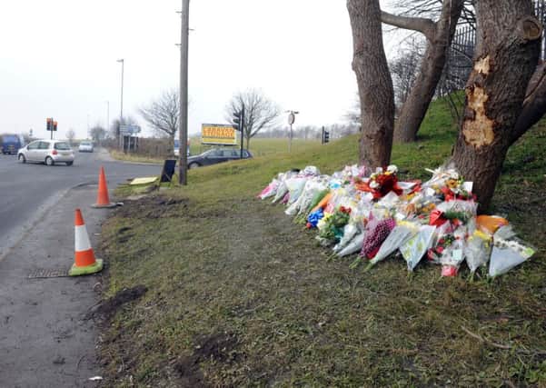 Flowers at scene of crash at Wakefield Road, Featherstone