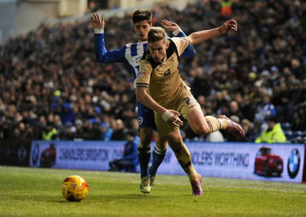 Charlie Taylor falls under pressure from Joao Teixeira in Leeds United's game at Brighton. Picture: Bruce Rollinson
