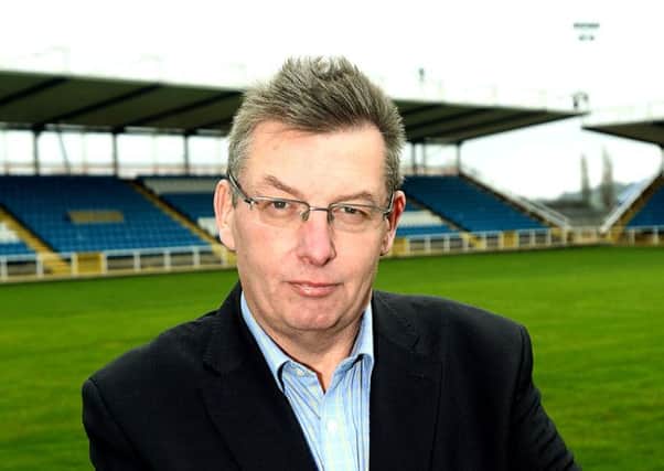 New Featherstone Rovers chief executive, Pat Cluskey. Pictured in front of the newly extended pitch and new stand.
p310c445