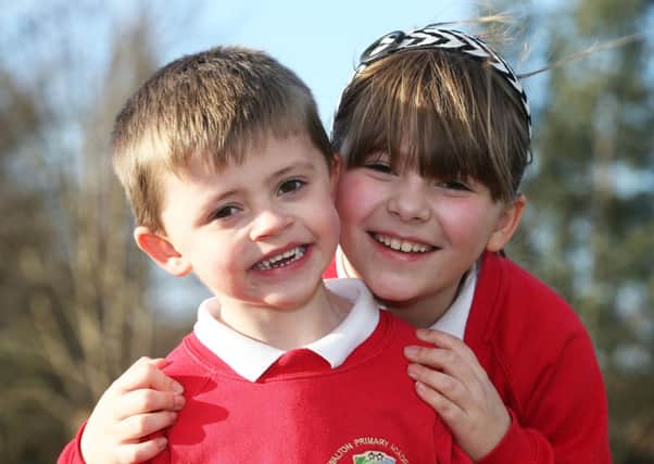 Kane Smith - who has Duchenne muscular dystrophy -  with his sister Kasey who is going to walk Pen-Y-Ghent to raise money for her brother.