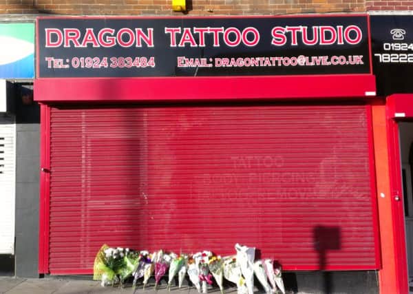 Floral tributes outside Dragon Tattoo Studio, Wakefield on Friday, March 6
