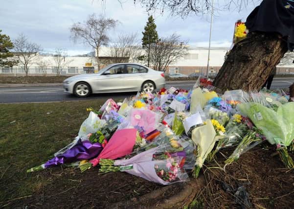 Florial tributes and messages at the scene of a fatal car crash on Gelderd Road, Morley.
