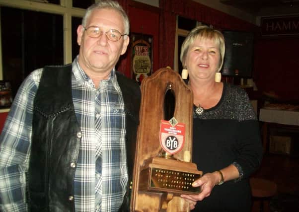 The Junction, Castleford's licensees Neil Midgley and Maureen Shaw with Wakefield CAMRA's pub of the year trophy