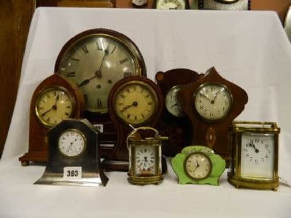 Clocks collected by Mr Lansberry on sale at the Louis Johnson auction.