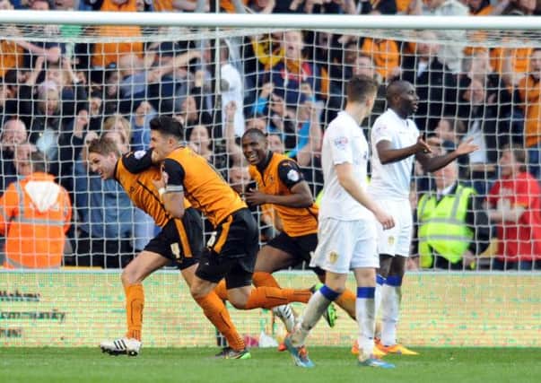Leeds United players look dejected after Wolves' Dave Edwards scores the winning goal. Picture:Simon Hulme