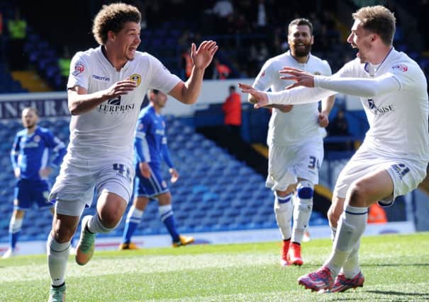 Kalvin Phillips celebrates scoring on his home debut for Leeds United, with Charlie Taylor looking delighted for the youngster.