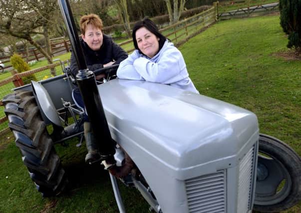 Mass tractor ride planned to raise money for Yorkshire Air Ambulance.
Pictured. Debra Pickering (sat on tractor) and Joanne Bulmer.
p302b412