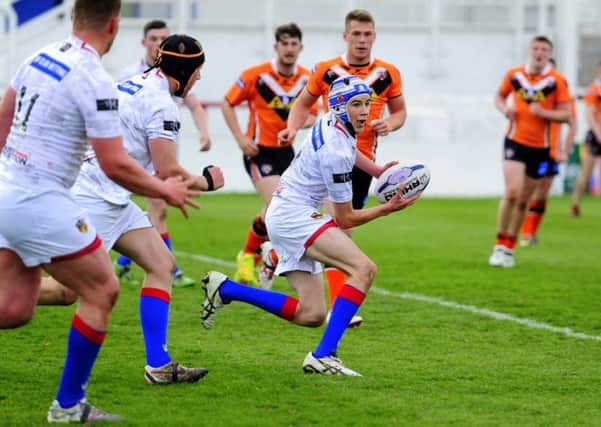 Scrum-half Scott Flemming gets Wakefield Wildcats under 19s moving in the derby game against Castleford Tigers. Picture: Matthew Merrick.
