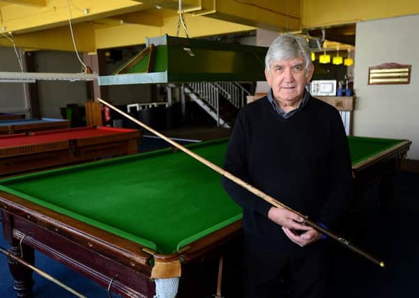 Wakefield Cathedral fundraiser Terry Rigg with the signed cue