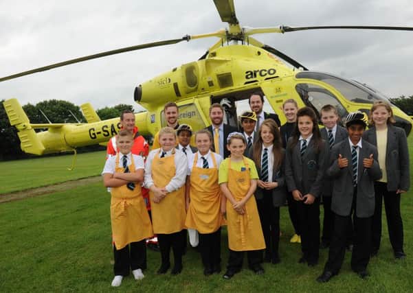 Yorkshire Air Ambulance visits Thornhill Academy for 'Wear it Yellow Day ' Staff and pupils. Picture Scott Merrylees SM1003/95c