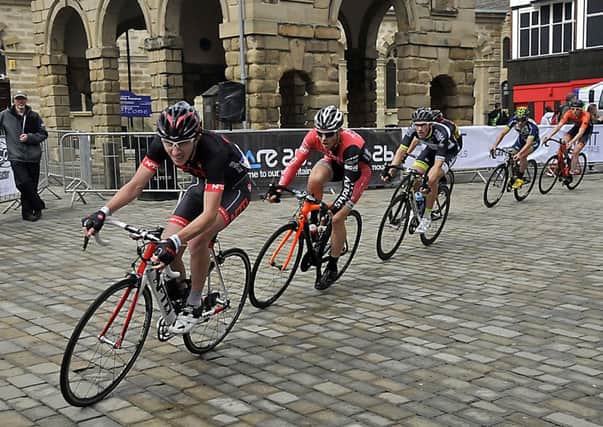 The Men's Elite Race as they pass through the Market Place at Pontefract Grand Prix Cycle race last year.