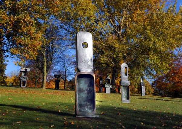 The Family of Man, a group of 9 individual bronze sculptures, one of Barbara Hepworths final works, completed in 1970 sits amongst the Autumnal trees at the Yorkshire Sculpture Park . Picture by Tony Johnson
