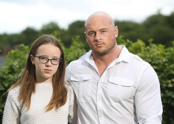 Picture shows 11-year-old Megan Oldfield with her father James at their home in Pontefract, West Yorkshire. See Ross Parry copy RPYECOLI. The father of an 11-year-old girl who suffered kidney damage after contracting E-coli following a school trip to a petting farm has spoken about his daughter's 'horrific' ordeal for the first time.
Megan Oldfield, from Pontefract, in West Yorkshire, was left dependent on dialysis for two weeks after visiting Cruckley Animal Farm in East Yorkshire in June 2011 where children were allowed to pet and feed the animals.
Ian Hinchliffe / Rossparry.co.uk