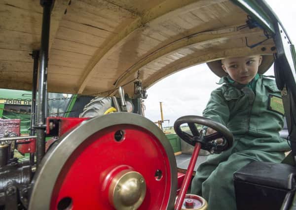 Picture by Allan McKenzie/AMGP.co.uk - 290614 - Press - Farmer Copley's Fayre, Farmer Copley's Farm, Pontefract, England - Harry Smith (4) on his little Horrell Brothers steam train.