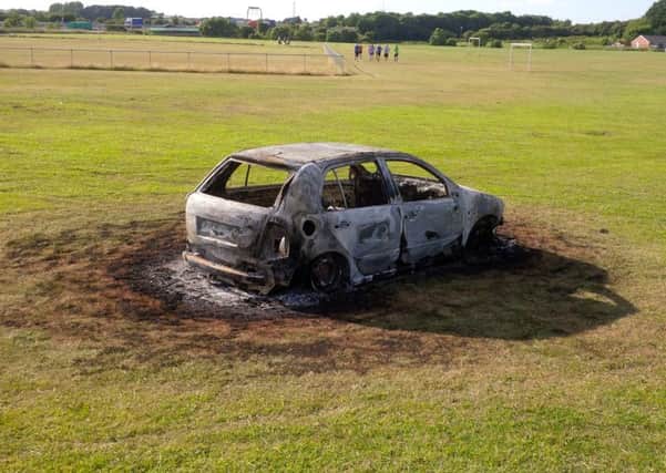 Yobs torched a car and caused £3,000 worth of damage to pitches belonging to Thornes Junior Football Club