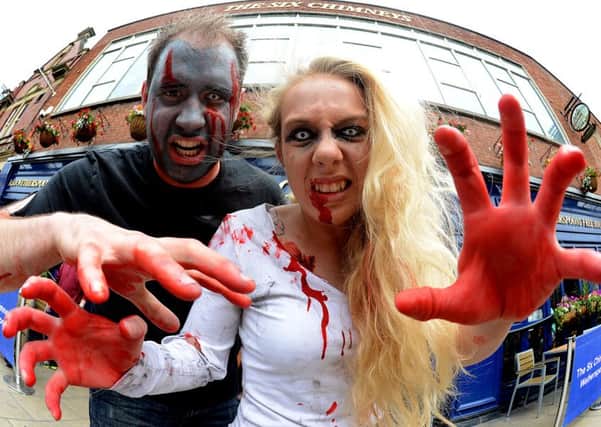Newspaper: Wakefield Express.
Story Staff at The Six Chimneys pub on Kirkgate, Wakefield, are taking part in the forthcoming Comic-Con weekend.
Pictured are The Walking Dead aka Brogan Turner and Tom Hudson.
Photo date: 24/06/15
Picture Ref: AB096b0615