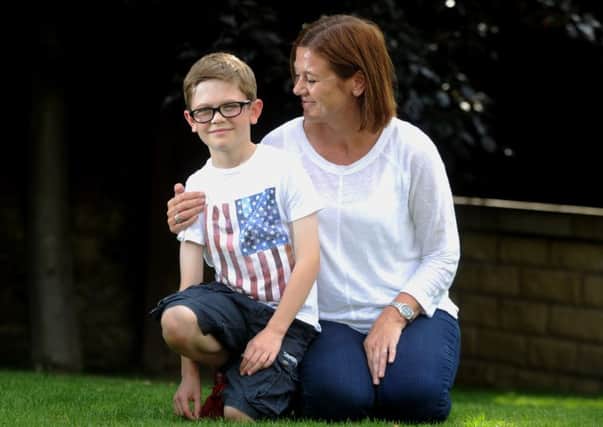 James Hodgson pictured with his mum Rachel Hodgson at their home in Sandal, Wakefield. Picture by Simon Hulme.