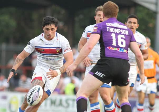 New signing Kevin Locke tries a kick and chase for Wakefield against Hull.
