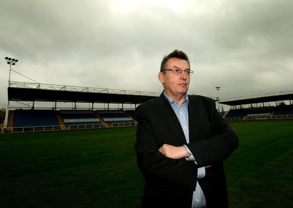 New Featherstone Rovers chief executive, Pat Cluskey. Pictured in front of the newly extended pitch and new stand.
p310a445