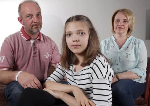 andy and jo longfellow with daughter abi aged 12 ..nhs refuse kidney drug treatment ,her dad is to give her a kidney transplant thou a drug to block disease is being refused so the operation is on hold.....also pictured elder sister jess
