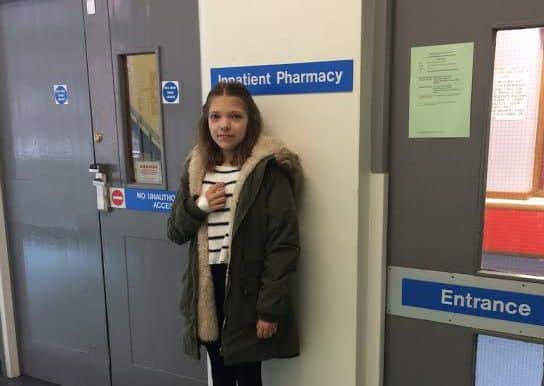 Abi Longfellow outside the room where the drugs she needs is kept.