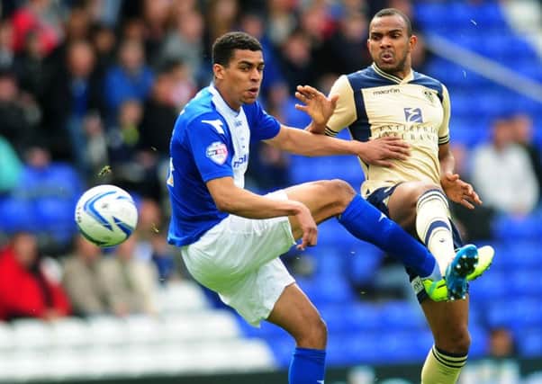 Tom Adeyemi, in action against Leeds United last season, up against the now departed Rudy Austin.