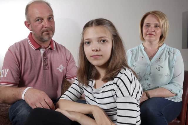andy and jo longfellow with daughter abi aged 12 ..nhs refuse kidney drug treatment ,her dad is to give her a kidney transplant thou a drug to block disease is being refused so the operation is on hold.....also pictured elder sister jess