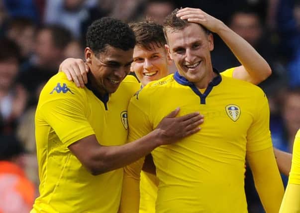 Chris Wood celebrates his goal for Leeds United against Everton with team-mates.