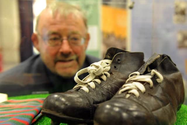 1/8/15  David Hinchliffe Chairman of the Trustees for the National Coal Mining Museum looking at the   rugby boots of  Brian Bevan an Australian player in the 1950's  part of  the Rugby League Cares Heritage Tour  which was at The National Mining Museum near Wakefield over the weekend. (GL1006/73f)