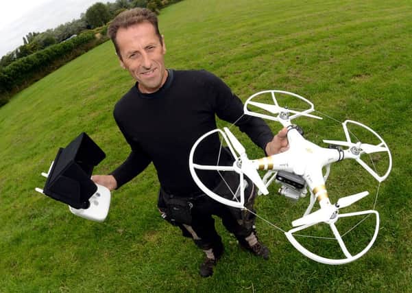 Newspaper: Wakefield Express // Morley Observer.
Story: Brian Wheelhouse, who runs the Whitehall Dog Rescue centre, East Ardsley, uses a drone to help exercise some of the dogs at the centre.
Photo date: 07/09/15
Picture Ref: AB201a0915