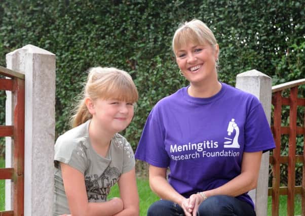 Meningitis survivor Danielle Sharpe with mum Kerrie at home in Pontefract. It is Meningitis Awareness Week.